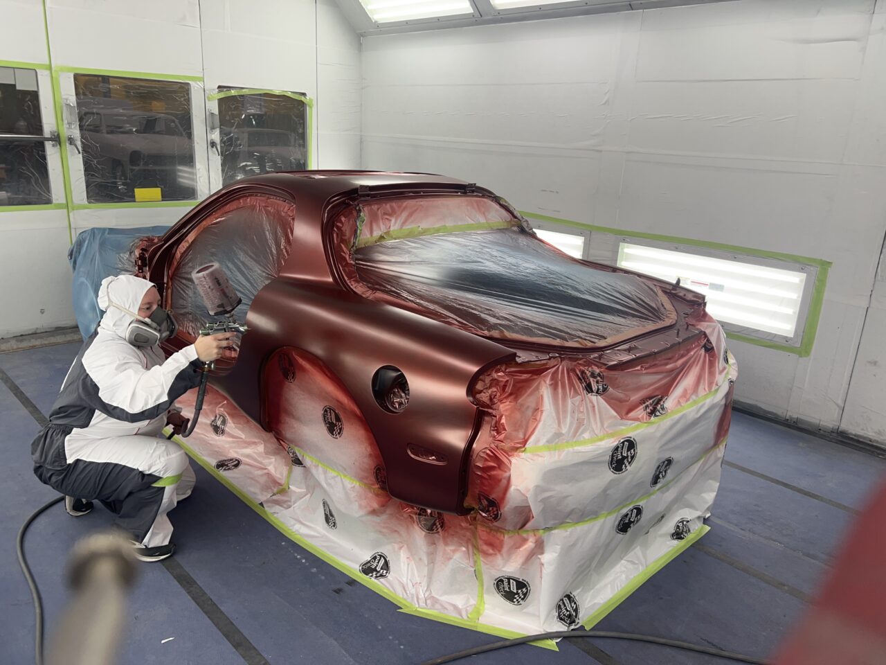 https://treasuredmotorcars.com/wp-content/uploads/2025/12/Dayna-spraying-rx7--1280x960.jpg